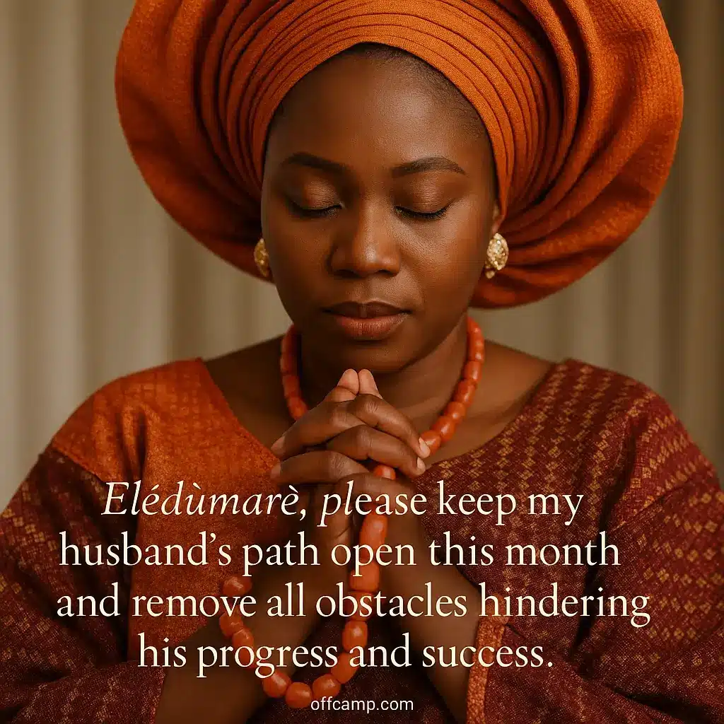 Woman in traditional Yoruba attire praying for her husband at the beginning of the month with cultural prayer beads